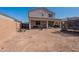 Large backyard area with a covered patio, perfect for outdoor activities and entertaining at 1744 W Hopi Dr, Coolidge, AZ 85128
