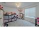 Spacious bedroom with bunk beds, a window, and a ceiling fan, perfect for or guests at 1744 W Hopi Dr, Coolidge, AZ 85128