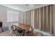 Cozy dining area with table set, neutral color palette, and sliding glass door at 1744 W Hopi Dr, Coolidge, AZ 85128