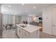Open-concept living space with the kitchen island overlooking dining area and living room at 1744 W Hopi Dr, Coolidge, AZ 85128
