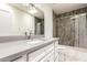 Modern bathroom with a shower/tub combo and a single sink vanity with gray countertop at 1831 N 77Th St, Scottsdale, AZ 85257