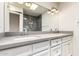 Modern bathroom with dual sinks, vanity, and large mirror with vanity lighting at 1831 N 77Th St, Scottsdale, AZ 85257