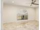 Bright bedroom featuring tile floors, a large window, and modern ceiling fan at 1831 N 77Th St, Scottsdale, AZ 85257