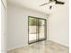 Well-lit bedroom featuring tile floors, ceiling fan, and sliding glass door at 1831 N 77Th St, Scottsdale, AZ 85257