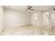 Large bedroom with tile flooring, ceiling fan, and ensuite bathroom access at 1831 N 77Th St, Scottsdale, AZ 85257