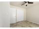 Bedroom with closet, ceiling fan and travertine floor at 1831 N 77Th St, Scottsdale, AZ 85257