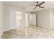Neutral bedroom with modern ceiling fan, tile floors and closet access at 1831 N 77Th St, Scottsdale, AZ 85257