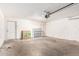Spacious garage with white walls and concrete floors at 1831 N 77Th St, Scottsdale, AZ 85257