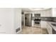 Spacious kitchen with stainless steel appliances, tile floors, and ample cabinet space at 1831 N 77Th St, Scottsdale, AZ 85257