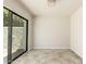 Bright living room with tile floors, modern paint, and a sliding glass door at 1831 N 77Th St, Scottsdale, AZ 85257