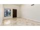 Bright living room with tile floors, modern paint, a window and dark trim at 1831 N 77Th St, Scottsdale, AZ 85257