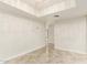Open living room with a tray ceiling, modern paint, and tile floors at 1831 N 77Th St, Scottsdale, AZ 85257