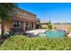 Expansive backyard featuring a private pool, patio, and desert landscaping for outdoor enjoyment at 18375 E San Ignacio Ct, Gold Canyon, AZ 85118