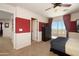 Bedroom featuring a ceiling fan, sliding glass door and views of the natural landscape at 18375 E San Ignacio Ct, Gold Canyon, AZ 85118