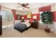 Bedroom with a large window, ceiling fan, and modern decor at 18375 E San Ignacio Ct, Gold Canyon, AZ 85118