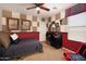 This bedroom features a ceiling fan and car racing themed decor at 18375 E San Ignacio Ct, Gold Canyon, AZ 85118