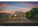Charming two-story home with desert landscaping, a three-car garage, and a welcoming entrance at 18375 E San Ignacio Ct, Gold Canyon, AZ 85118