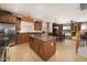Open concept kitchen featuring a central island, stainless steel appliances, and tile flooring at 18375 E San Ignacio Ct, Gold Canyon, AZ 85118