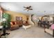 Open-concept living room seamlessly connects to the kitchen and dining area, perfect for entertaining at 18375 E San Ignacio Ct, Gold Canyon, AZ 85118