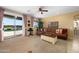 Inviting living room features a comfortable sectional sofa and sliding glass doors to the outdoor pool area at 18375 E San Ignacio Ct, Gold Canyon, AZ 85118