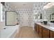 Bathroom featuring double sinks, bathtub, and shower at 18375 E San Ignacio Ct, Gold Canyon, AZ 85118