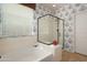 Bathroom featuring bathtub, shower, and patterned wallpaper at 18375 E San Ignacio Ct, Gold Canyon, AZ 85118