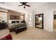 Large main bedroom featuring carpet flooring and a full length mirror at 18375 E San Ignacio Ct, Gold Canyon, AZ 85118
