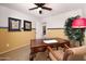 This office offers a wooden desk, chair, wall decor, and plenty of natural light at 18375 E San Ignacio Ct, Gold Canyon, AZ 85118