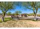 A playground with slides and benches in a well-maintained park with desert landscape at 18375 E San Ignacio Ct, Gold Canyon, AZ 85118
