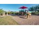 Scenic community playground with swings, slides, and a covered picnic area at 18375 E San Ignacio Ct, Gold Canyon, AZ 85118