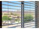 View of the mountains, houses, and neighborhood through the window at 18375 E San Ignacio Ct, Gold Canyon, AZ 85118