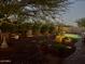 Secluded backyard with a beautiful pool, water feature, and outdoor dining area at 20502 W Ridge Rd, Buckeye, AZ 85396