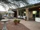 Expansive backyard featuring covered patio, lounge area, hot tub and well-manicured landscaping at 20502 W Ridge Rd, Buckeye, AZ 85396