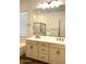 Bright bathroom with a large mirror over double vanity and features a bathtub and glass shower at 20502 W Ridge Rd, Buckeye, AZ 85396