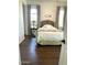 Bedroom with a large bed, side table, and natural light from the window at 20502 W Ridge Rd, Buckeye, AZ 85396