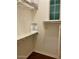 Walk-in closet with custom shelving, hanging space, and a small window at 20502 W Ridge Rd, Buckeye, AZ 85396