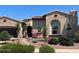Charming single-story home with desert landscaping, stone accents, and tiled roof at 20502 W Ridge Rd, Buckeye, AZ 85396