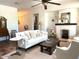 Cozy living room featuring a fireplace, comfortable seating, and natural light at 20502 W Ridge Rd, Buckeye, AZ 85396