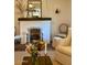 Elegant living room with a brick fireplace and neutral decor at 20502 W Ridge Rd, Buckeye, AZ 85396