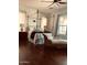 Comfortable main bedroom with hardwood floors, a four-poster bed, and bright natural light at 20502 W Ridge Rd, Buckeye, AZ 85396