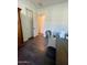 View of the office space with hardwood flooring and closet doors at 20502 W Ridge Rd, Buckeye, AZ 85396