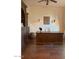 Home office with built-in shelving, large desk, and wood floors at 20502 W Ridge Rd, Buckeye, AZ 85396