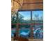 Inviting pool area with comfortable lounge chairs, seen through expansive windows at 20502 W Ridge Rd, Buckeye, AZ 85396