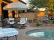 Wonderful pool and patio area featuring dining and lounge seating with water feature at 20502 W Ridge Rd, Buckeye, AZ 85396