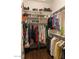 Walk-in closet with shelves and hanging rods for optimal storage at 20502 W Ridge Rd, Buckeye, AZ 85396