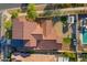 Aerial view of the property showcasing the roof, landscaping, and backyard with turf at 20518 W White Rock Rd, Buckeye, AZ 85396