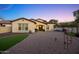 Backyard view of house featuring a covered patio, outdoor grill, and well-maintained yard at 20518 W White Rock Rd, Buckeye, AZ 85396