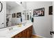 Bathroom featuring a double sink vanity and modern finishes at 20518 W White Rock Rd, Buckeye, AZ 85396
