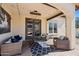 Inviting covered patio with comfortable seating and stylish decor for outdoor relaxation at 20518 W White Rock Rd, Buckeye, AZ 85396