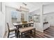 Charming dining room with bench seating, plantation shutters and an open view into the living area at 20518 W White Rock Rd, Buckeye, AZ 85396